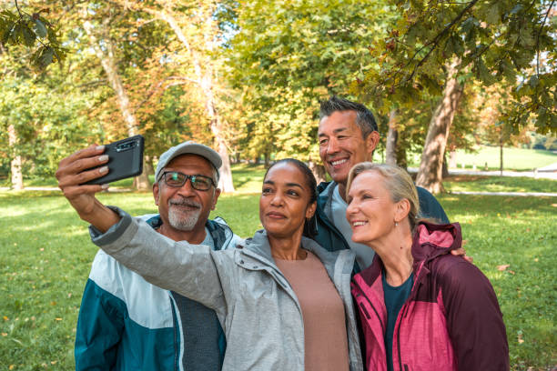 istock Diverse Friends Taking a Selfie with Smartphone in a Public Park After Workout 2158791996