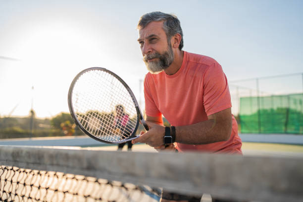 istock Elderly couple playing tennis 2158792871