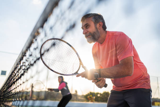 istock Elderly couple playing tennis 2158792883