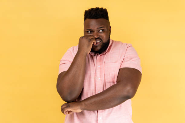 istock Man biting nails, nervous about troubles, panicking and looking scared. 2158792918