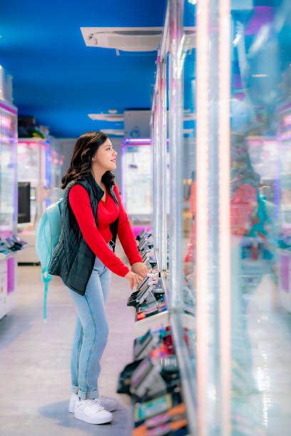 istock Latina Enjoying Arcade Games in Tokyo 2158793095