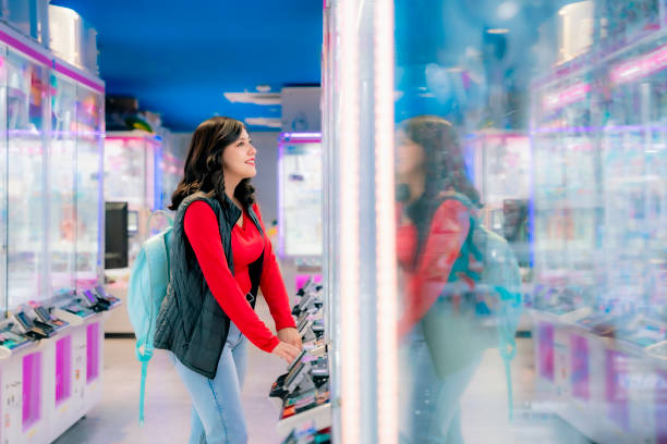 istock Latina Enjoying Arcade Games in Tokyo 2158793099