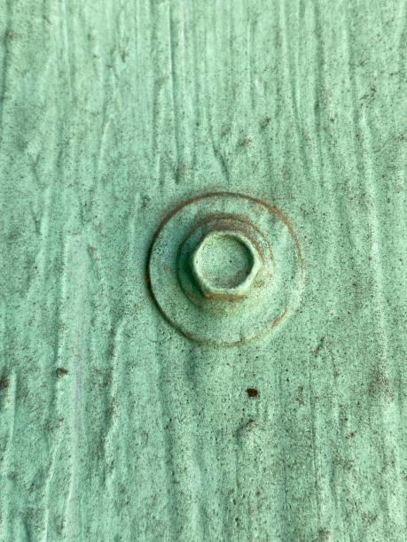 istock bolt on green metal sheet wall 2158793261