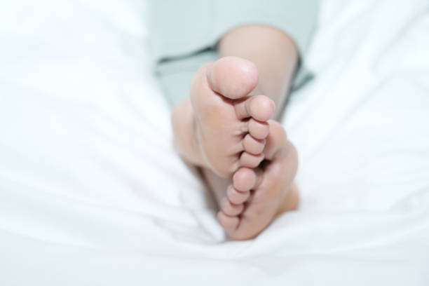 istock Clean woman's feet on the mattress 2158797444