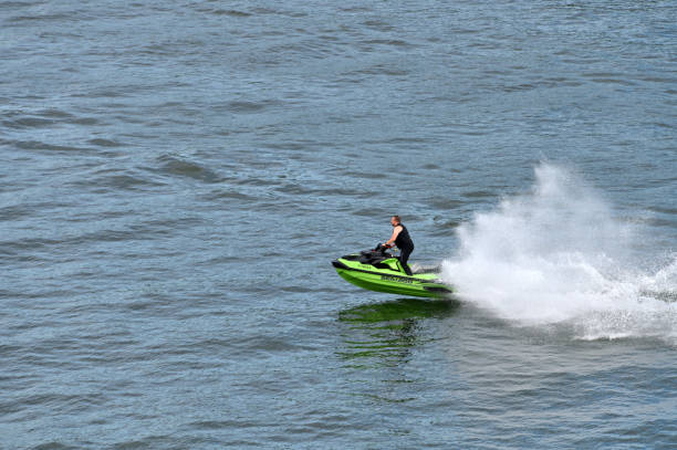 Estonia, Tallinn, August 13, 2023: An unidentified man rides a jet ski in Tallinn Bay, Estonia.