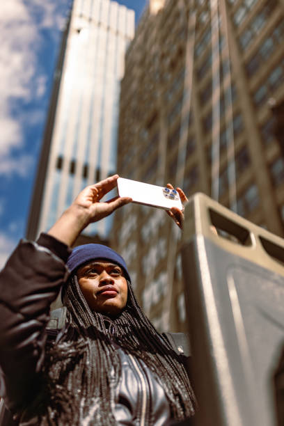 istock Tourist Capturing Downtown Skyscrapers on a Sunny Day 2158798739
