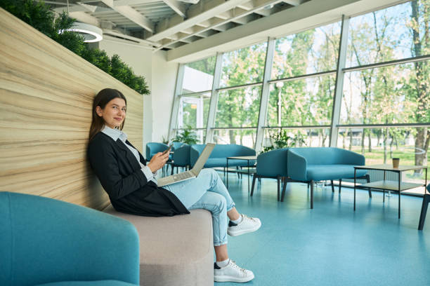 istock Progressive young girl with phone looking at camera 2158798791