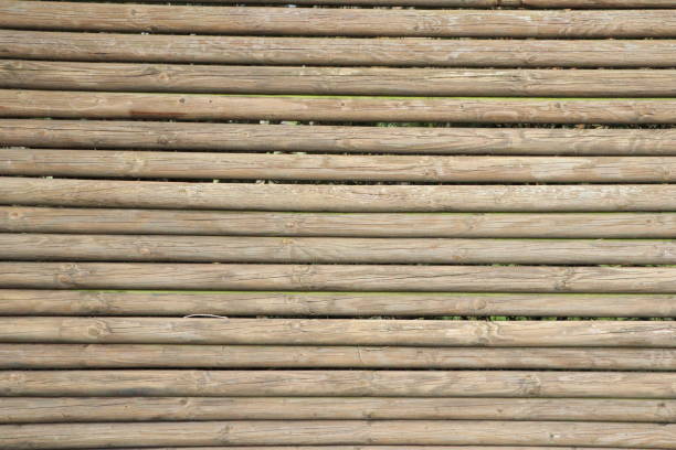 Wooden planks background texture showing natural timber surface, ideal for design and construction use.