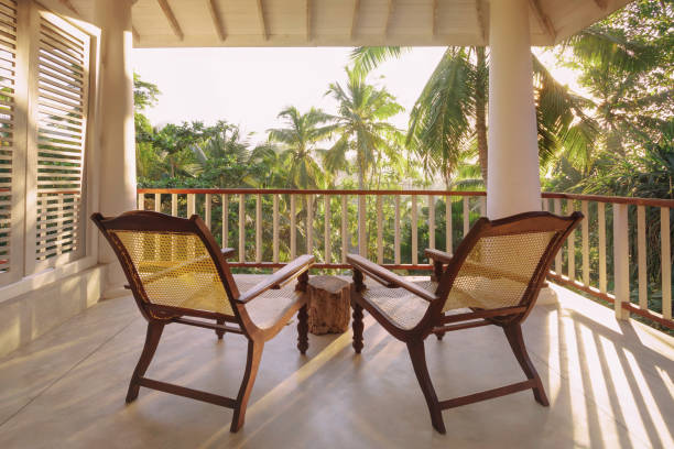 istock Tranquil Balcony with Chairs Overlooking Tropical View 2158801210
