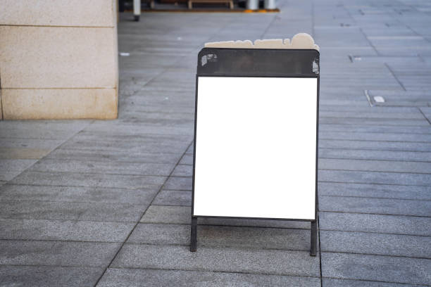 istock Blank white outdoor advertising stand or sandwich board mock up template. 2158801229