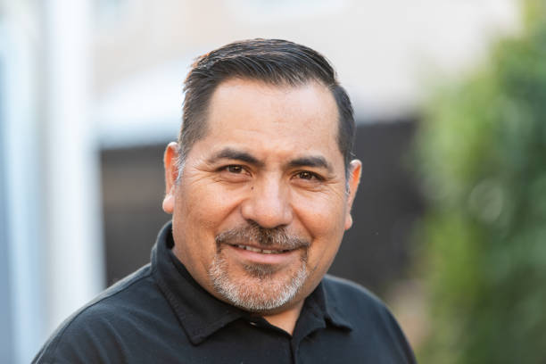 istock Smiling hispanic mature man posing looking at the camera 2158804966
