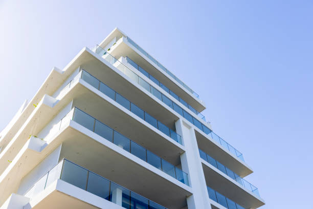 istock Brand new, modern apartment building, low anglew view, background with copy space 2158805638