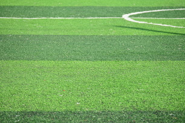 istock artificial green grass soccer field with sunlight, training football yard 2158806465