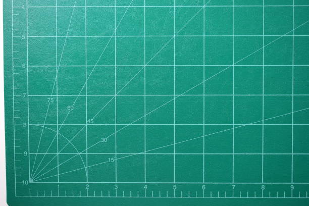 istock green cutting mat board background with line and scale measure guide pattern for object art design, tool equipment of diy craft work 2158806502
