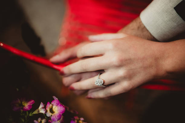 istock Couple showing off diamond engagement ring with copy space 2158806639