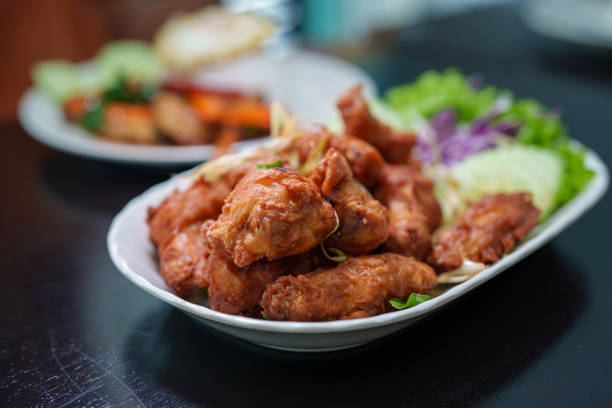 A plate of crispy shrimp paste fried chicken wings