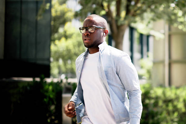 istock Efficient African American Courier Navigating Busy City Streets 2158807910