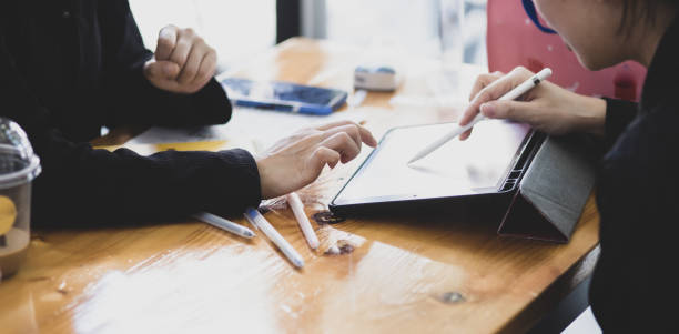 istock Technology and financial advisory services concept. Business teamwork and working on digital tablet with advisor showing plan. 2158809610