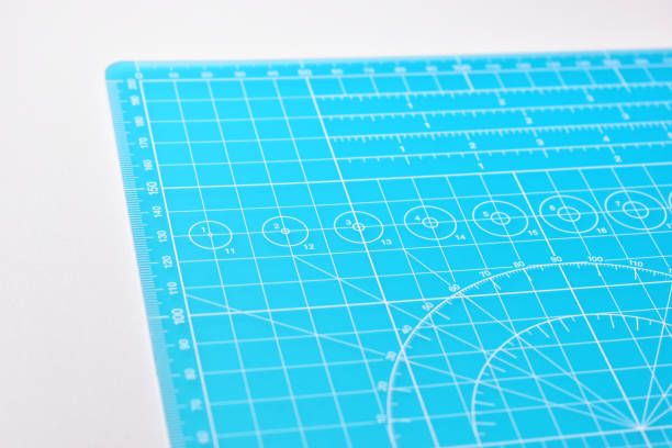 istock blue cutting mat board on white background with line and scale measure guide pattern for object art design, tool equipment of diy craft work 2158810229