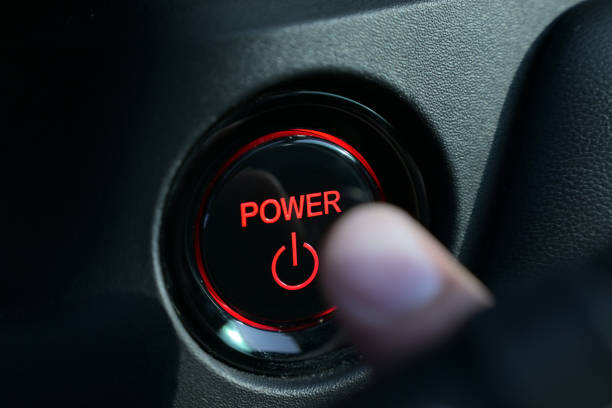 istock finger push start power engine system button of electric vehicle car 2158810287