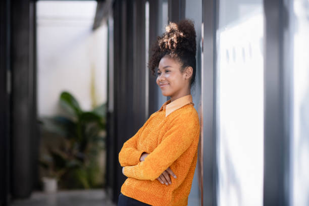 istock Young African American woman using call phone at outside. 2158811219