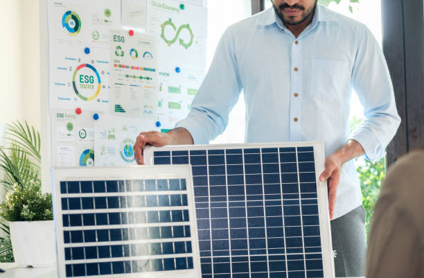 istock Diversity team presentation new design solar cell panel renewable energy innovation at office 2158811549