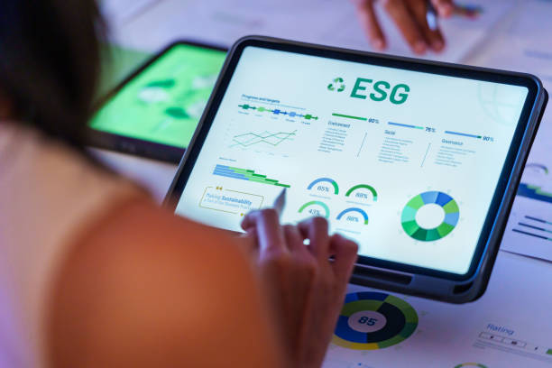 istock ESG ( environment, social,governance) recycle sign on laptop screen with carbon free chart board in office 2158811739