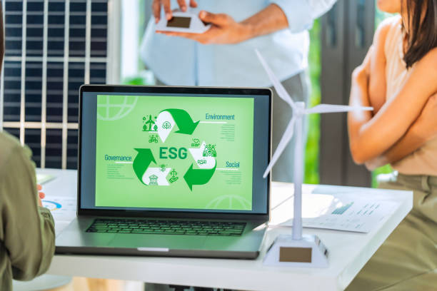 istock ESG ( environment, social,governance) recycle sign on laptop screen with carbon free chart board in office 2158811889
