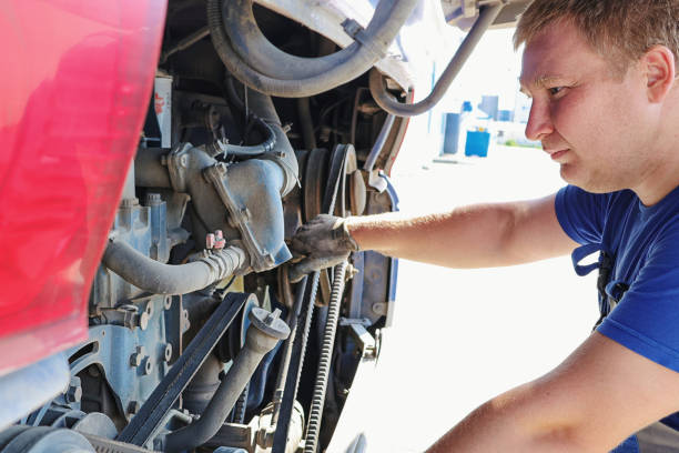 istock Professional mechanic inspects and repairs bus engine. 2158814828