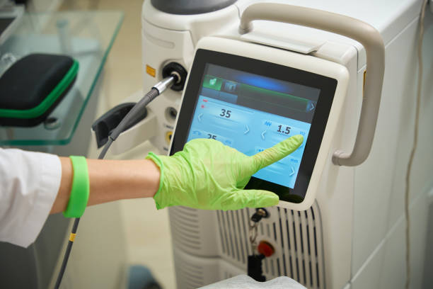 istock Woman doctor uses a modern laser device in her work 2158816822