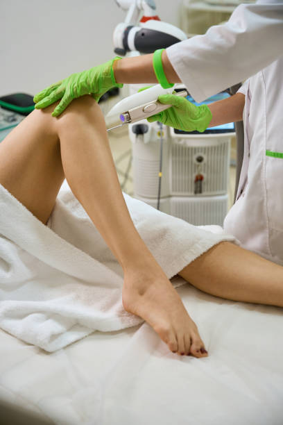 istock Doctor performs a vaginal wall rejuvenation procedure on a patient 2158816883