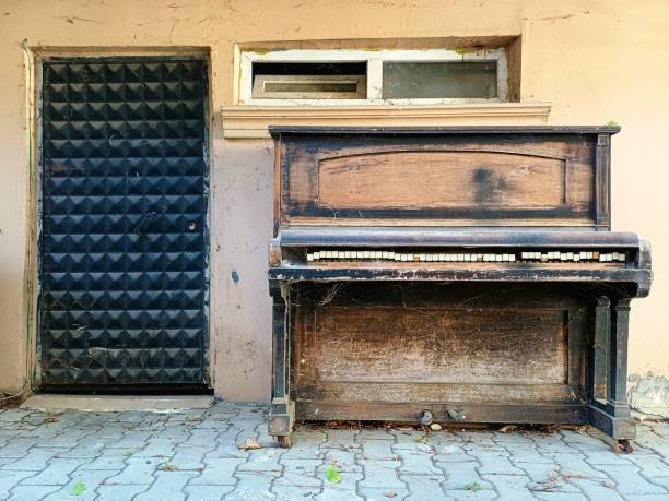 istock Old piano left on the street. Retro style. 2158817340