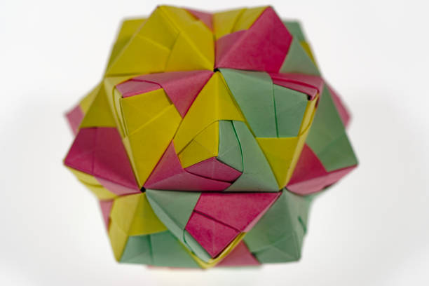 istock High angle view of handmade paper cube in different colors against white background. 2158819888