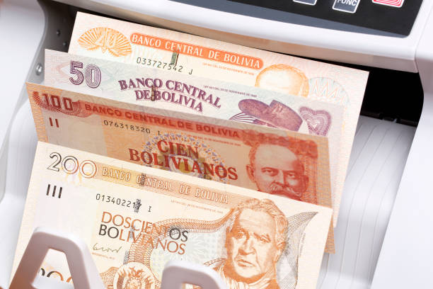 istock Bolivian boliviano in the counting machine 2158821189
