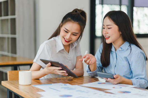 istock Two businesswomen reviewing data on a tablet in an office. 2158826815