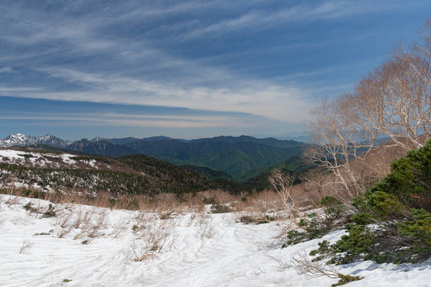 istock Mt. Norikura in May with snow still remaining 2158827229