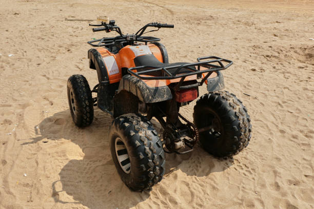 istock A four-wheeled beach buggy is placed on the beach waiting for someone to drive it. 2158827828