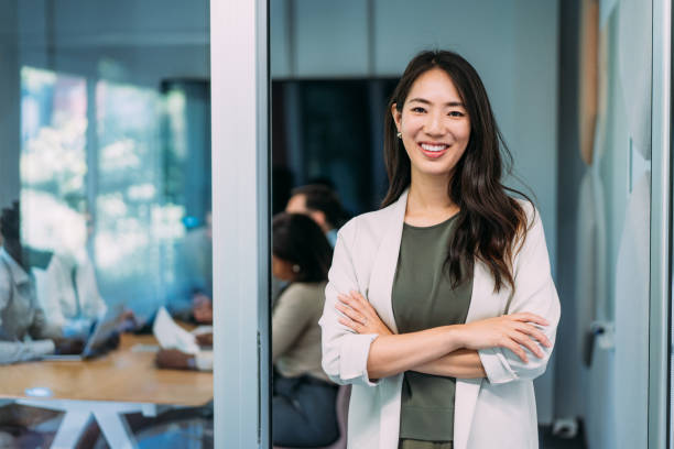 istock Confident businesswoman and her team. 2158828283
