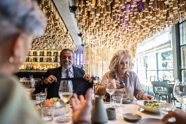 istock Coworkers talking and eating on a japanese restaurant 2158830989