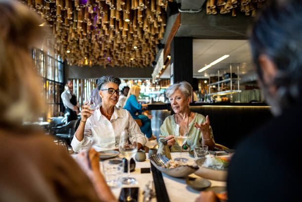 istock Coworkers talking and eating on a japanese restaurant 2158831000