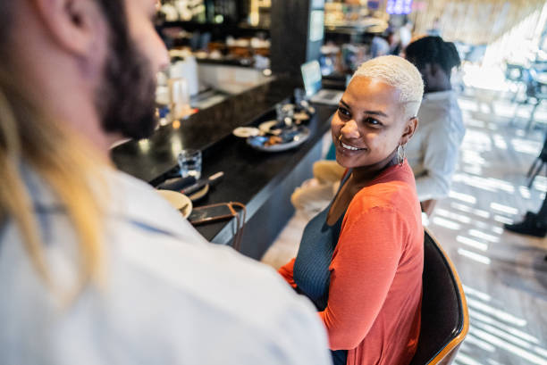 Woman talking with waiter on a japanese restaurant