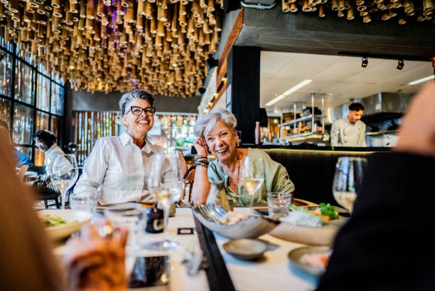istock Coworkers talking on a japanese restaurant 2158831075