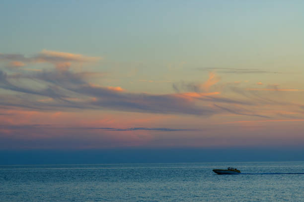 Silhouette of a speedboat in the Mediterranean during the blue hour