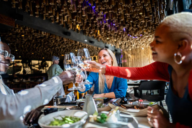 istock Coworkers toasting on a japanese restaurant 2158831272