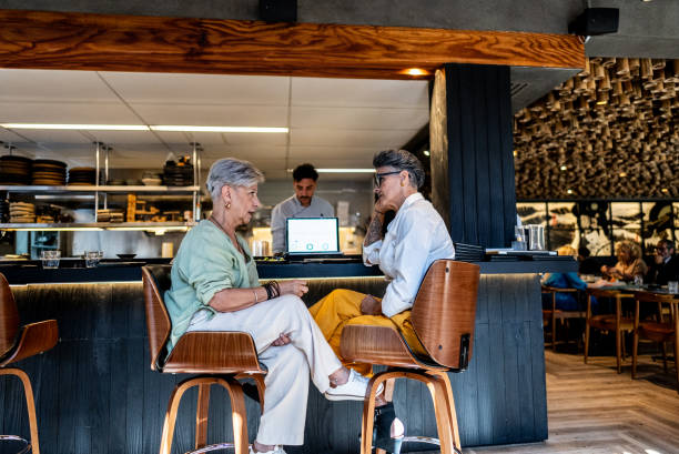 istock Coworkers talking on a japanese restaurant 2158831360