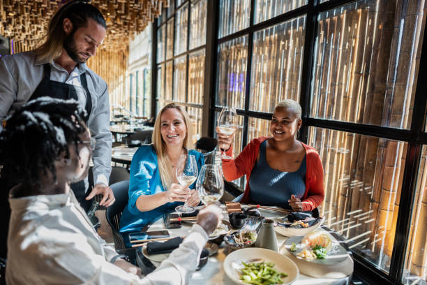 istock Waiter serving customers on a japanese restaurant 2158832035