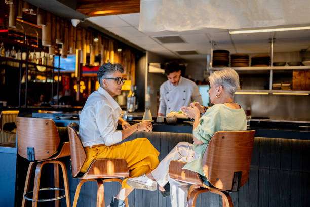 istock Coworkers talking on a japanese restaurant 2158832366