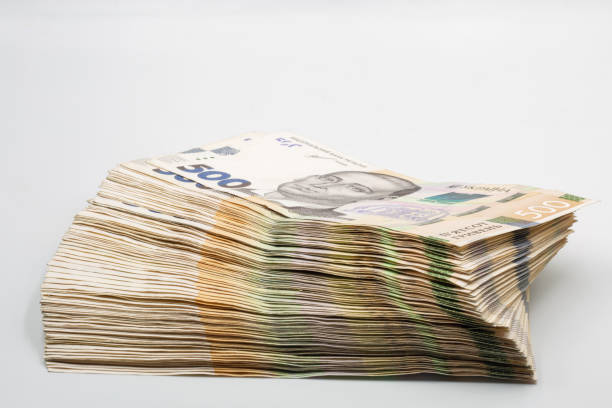 istock Ukrainian hryvna currency notes heap closeup on white. 2158832485