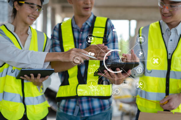 istock Construction team, blueprint and site building job for architect, builder and engineer sketching a construction project. 2158832717