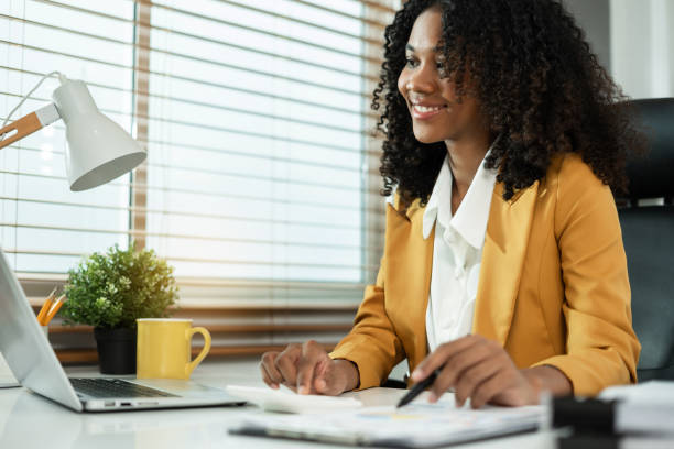 istock Female writes information businessman working on laptop computer writing business plan while sitting in office. 2158832726